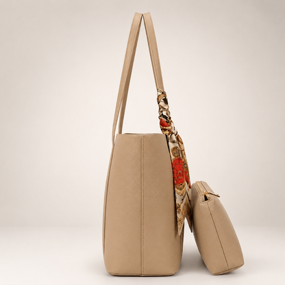 Beige handbag with a floral-patterned strap on a light beige background
