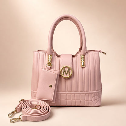 Pink handbag with gold accents on a beige background