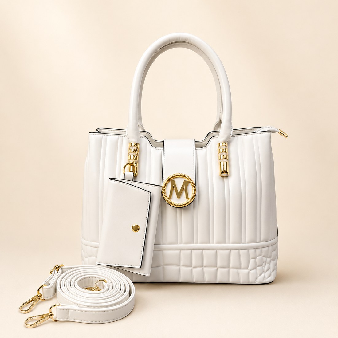 White handbag with gold accents on a beige background