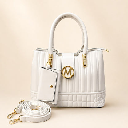 White handbag with gold accents on a beige background