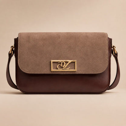 Brown suede handbag with gold clasp on a beige background