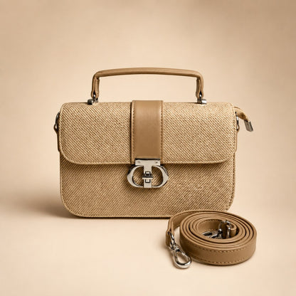 Beige handbag with matching strap on a beige background