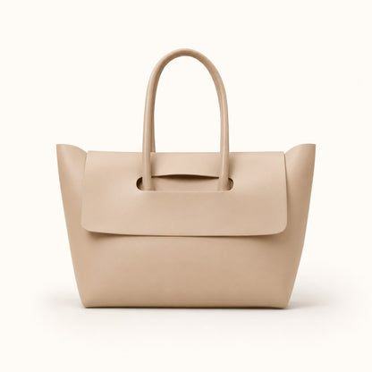 Beige handbag with a flap on a white background
