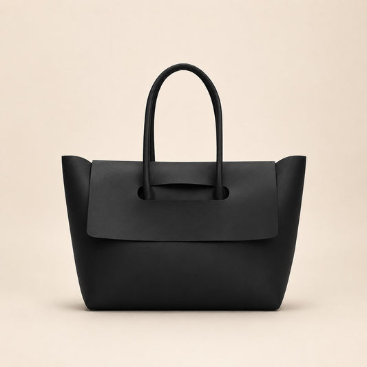 Black handbag on a beige background