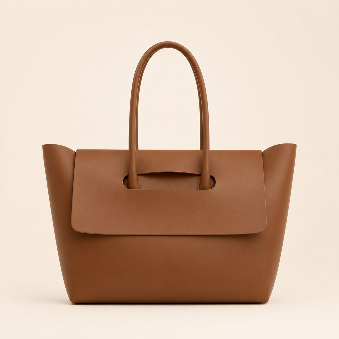 Brown leather handbag on a beige background