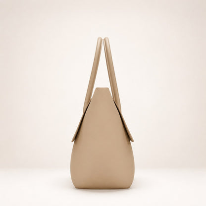 Beige handbag with a minimalist design on a light beige background