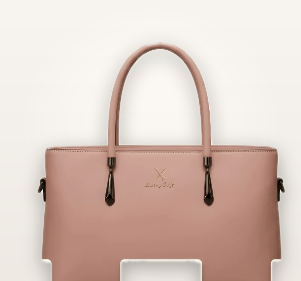Pink handbag with a visible brand logo on a white background